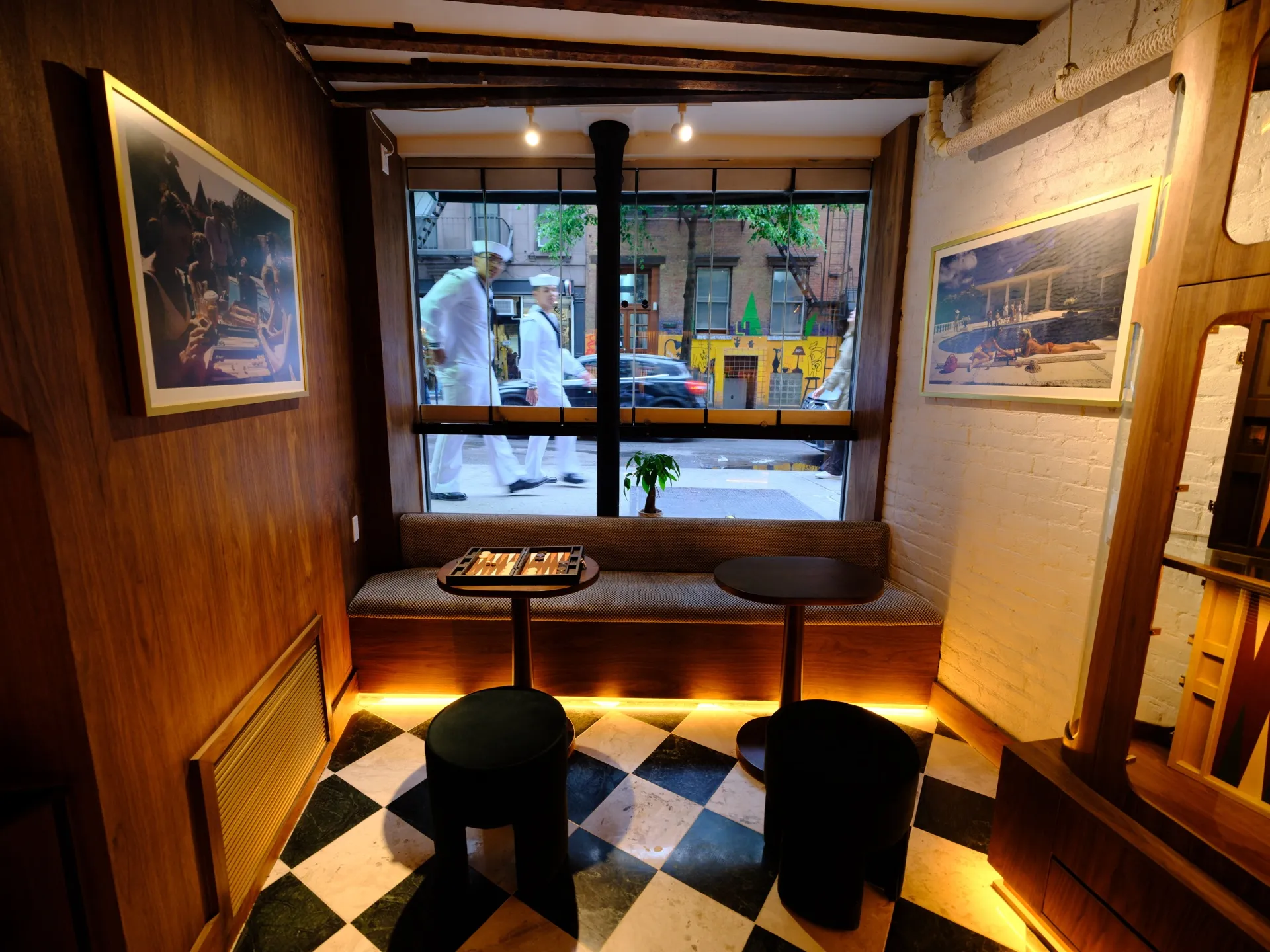 The window seating area and backgammon tables inside 7 Spring.