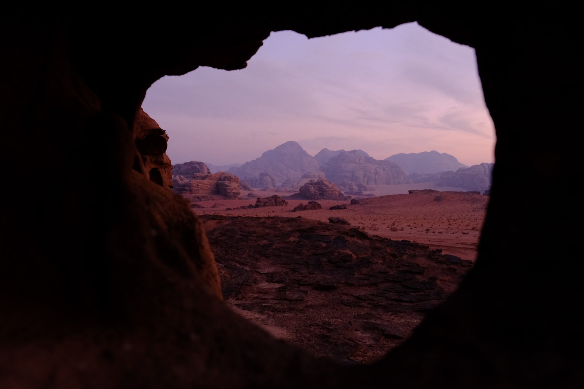 The Wadi Rum desert at dusk, seen through a sandstone opening. Photograph by Eugene Aarons.